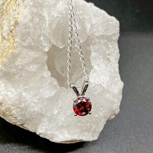 Elegant Silver Necklace with Deep Red Gemstone